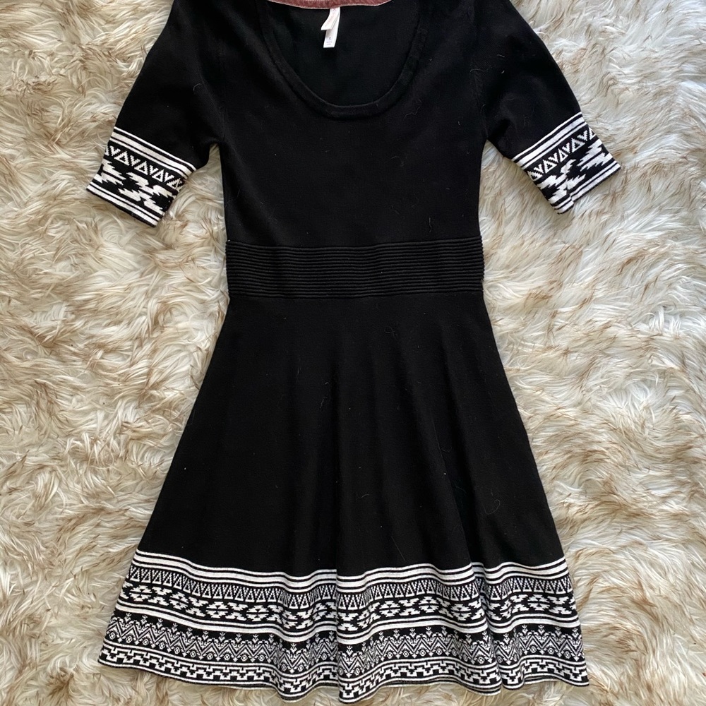 Black dress with gorgeous trim pattern